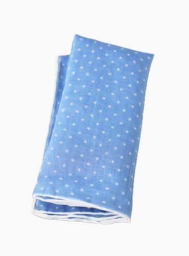 A blue linen pocket square with white dots.