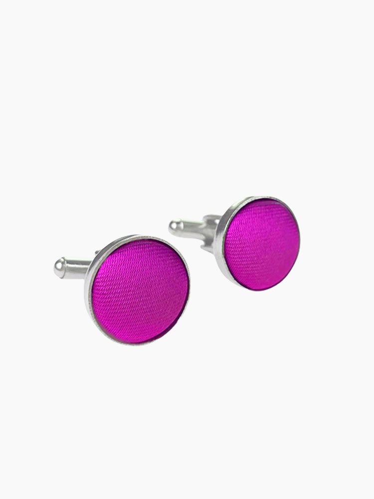 A pair of stylish begonia - colored cufflinks with a shiny finish.