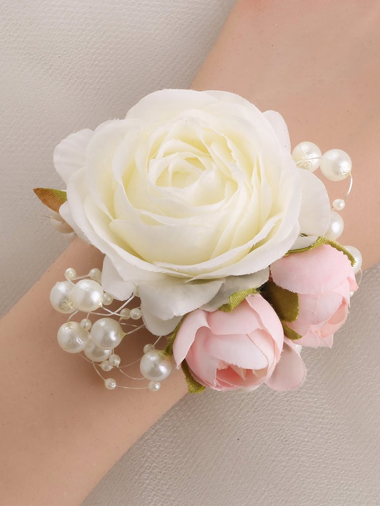 White and pink rose wrist corsage with pearl accents