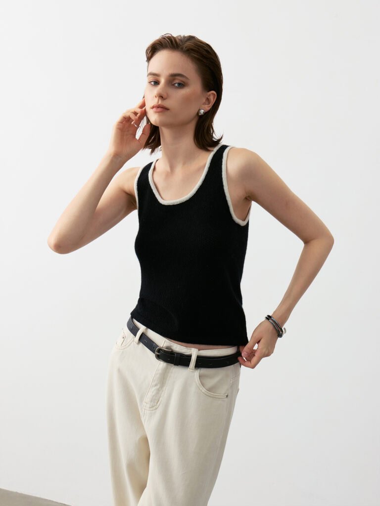 Luxury Rebel Cashmere Tank Top Outfit | Black with Contrast Trim (Ivory/Black) Paired with Ivory Wide-Leg Jeans & Black Belt - Edgy Luxury