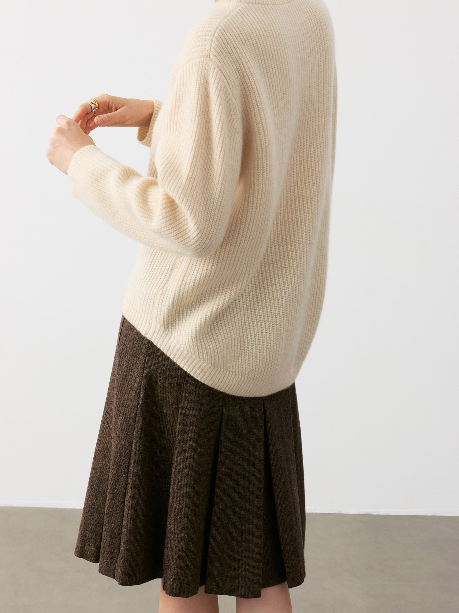 Luxury Rebel Cashmere Crewneck Sweater Outfit | Soft Beige & Brown Pleated Skirt Side Detail - Edgy Luxury