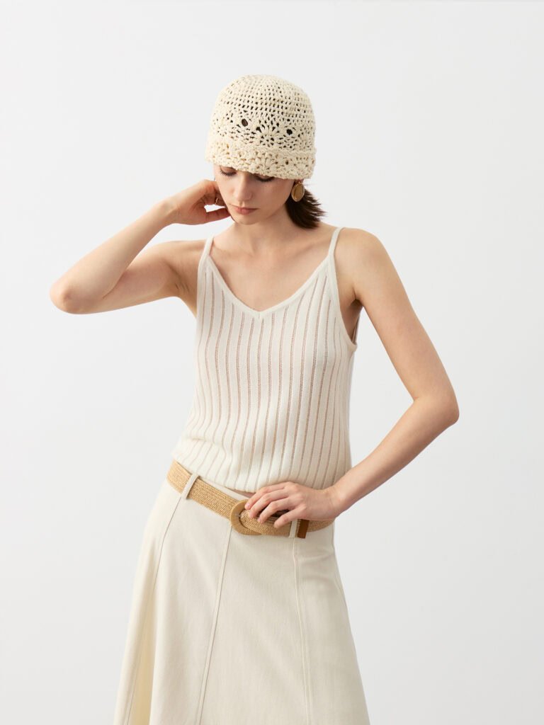 Model Wearing Pure Cashmere V-Neck Ribbed Camisole with Beige Maxi Skirt, Brown Belt, Knit Beanie, and Brown Shoes
