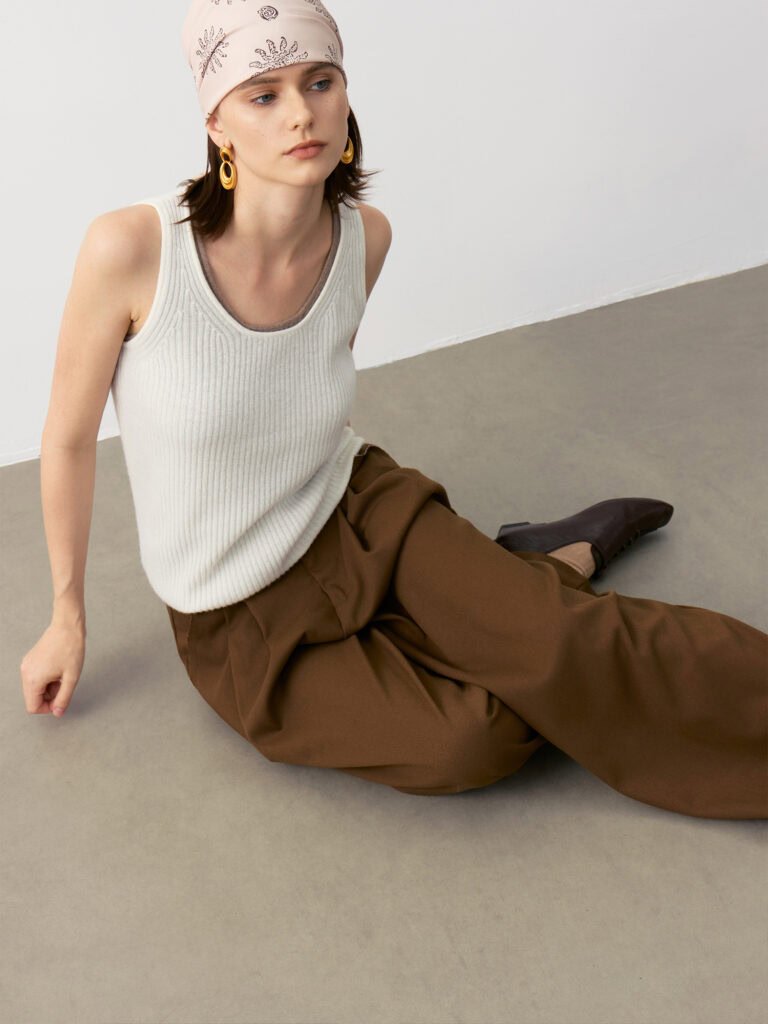 Model Wearing Pure Cashmere U-Neck Ribbed Camisole in Ivory White & Taupe Brown with Brown Wide-Leg Pants and Headscarf