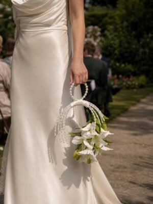 02_white-lily-waterfall-pearl-hoop-bridal-bouquet-bride-hold