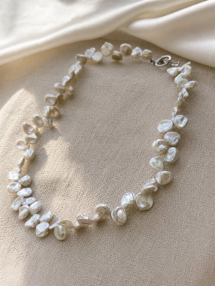 Silver-white petal Keshi freshwater pearl necklace with organic baroque pearls and toggle clasp