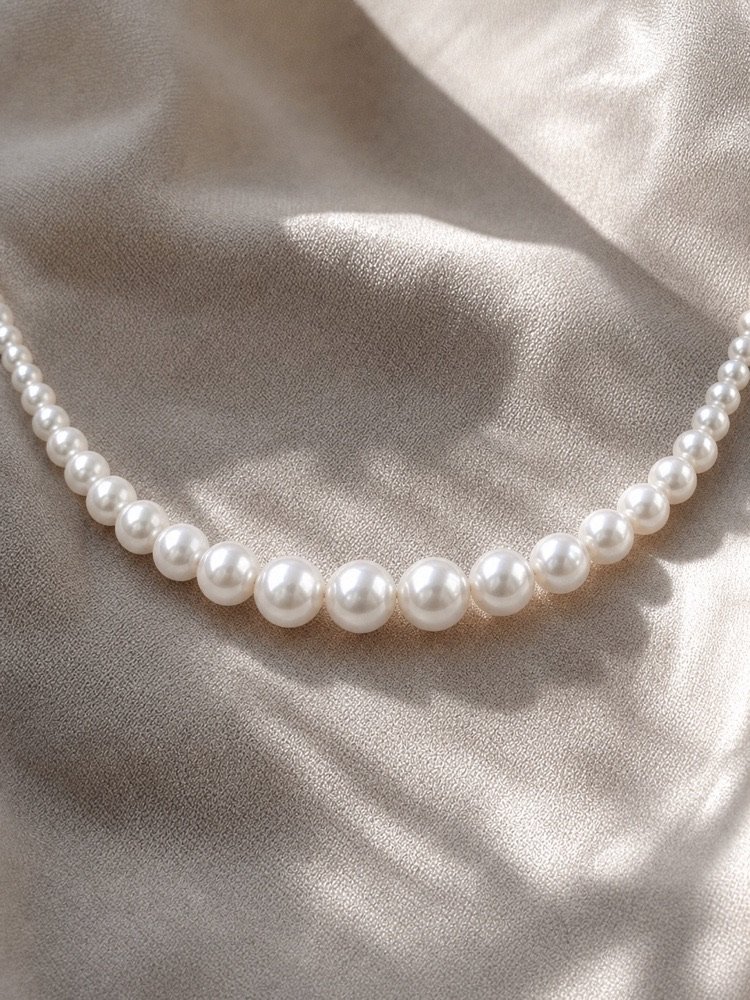 Close-up of luminous graduated cultured freshwater pearls with subtle silver iridescence