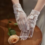 Sheer bridal glove detail sample for wedding portraits and ceremony styling